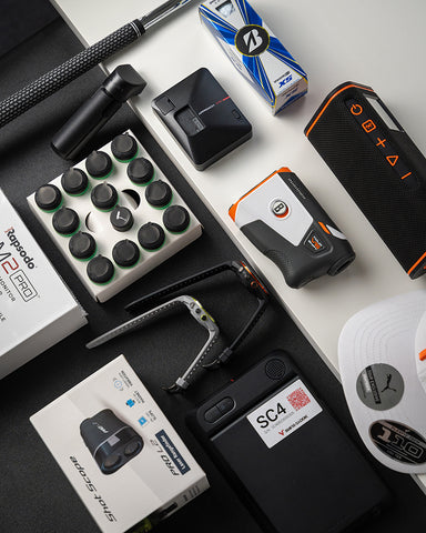 Several PlayBetter golf products laying on a desk