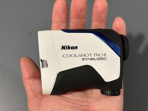 The Nikon COOLSHOT PROII Stabilized sitting in golf reviewer Marc's palm