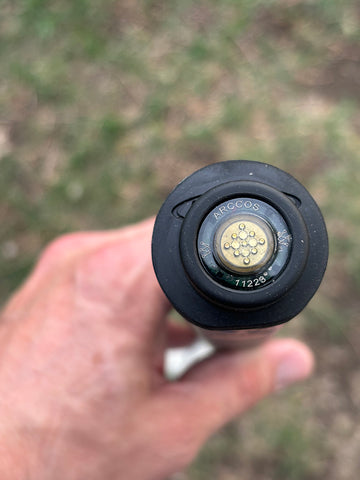 Top view of an Arccos Smart Sensor on a club