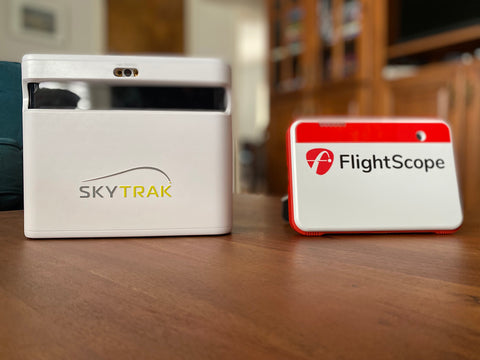 SkyTrak+ and FlightScope Mevo+ standing next to each other on a table