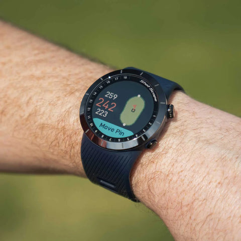 The Shot Scope X5 with distances on the display on a golfer's wrist on the course