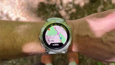 The new Up Ahead navigation feature displayed on topo maps on a Garmin watch on a wrist