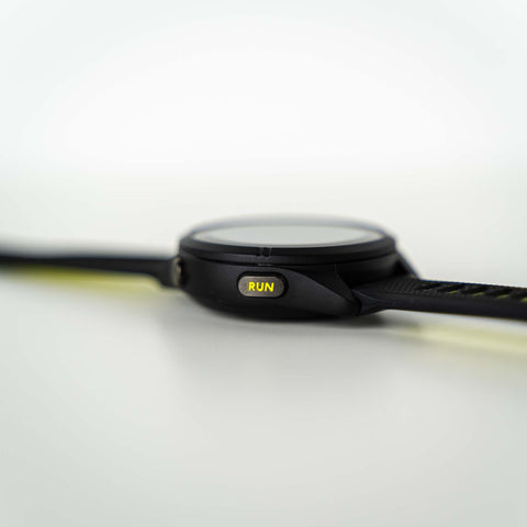 Side view of the Garmin Forerunner 265S laying flat with the run button showing on the side of the watch