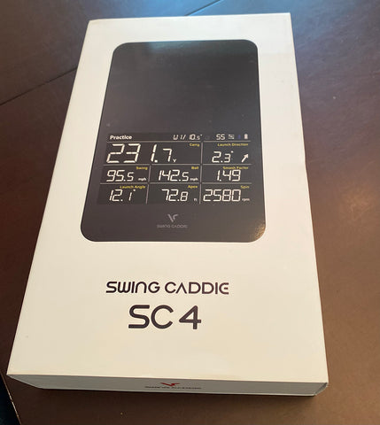 Closeup of the Swing Caddie SC4 in its original packaging setting on a table