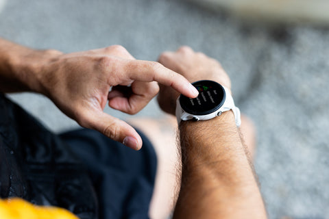 The Garmin Forerunner 955 running watch on a man's wrist