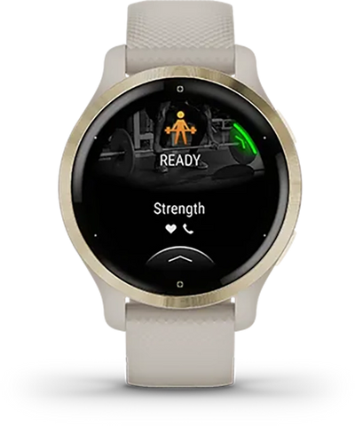 A gold and tan Garmin watch with strength workout on the display