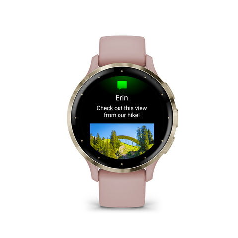 Gold and dust rose Garmin Venu 3S GPS smartwatch with text image on the display