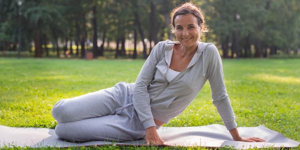 An active woman exercises in the park to stay healthy during menopause and revitalize her sexual desire.