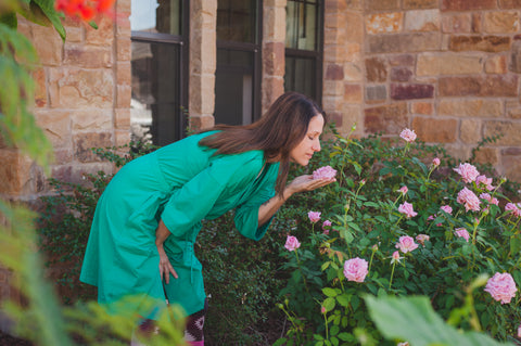 woman smelling the roses