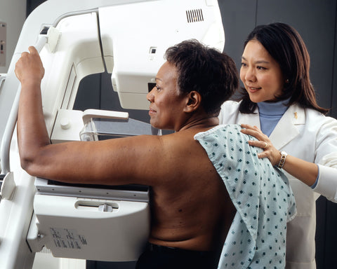 woman getting mammogram