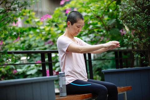 woman exercising on bench