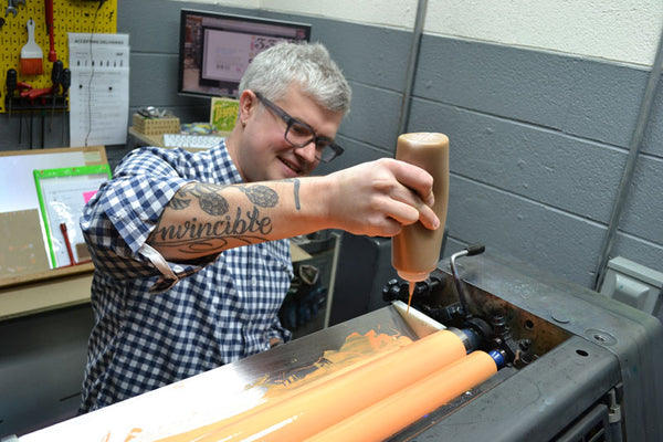 Dave Adding frosting to ink for 33 Doughnuts on Press