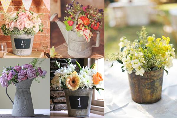 Six buckets of flowers presented as ideas for a rustic wedding centrepiece