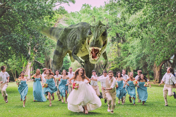 A photoshopped photograph of a wedding party running away from dinosaurs