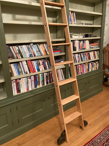 Hand built bookcases by Christopher Hamilton with a library ladder from the library ladder company 