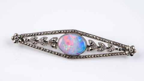 antique silver brooch with opal gemstone