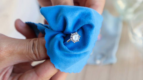 jewellery cleaning diamond ring with microfibre cloth