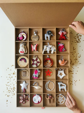 A visual of handcrafted ornaments in a box of 24