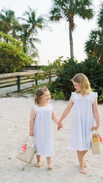 Grace's girls are sporting the ‘Mini Core’ tote bags.  They are the perfect Mommy and Me bags because they're easy to knock or rinse the sand off the bag!