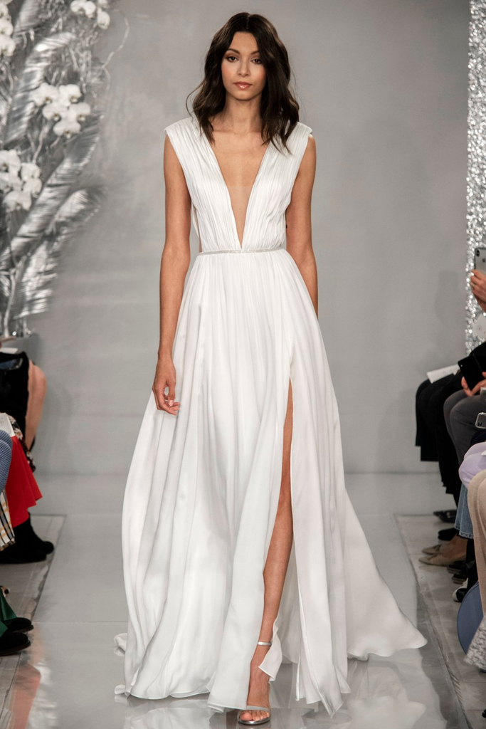 woman modeling Theia Agnetha gathered crepe a-line wedding dress
