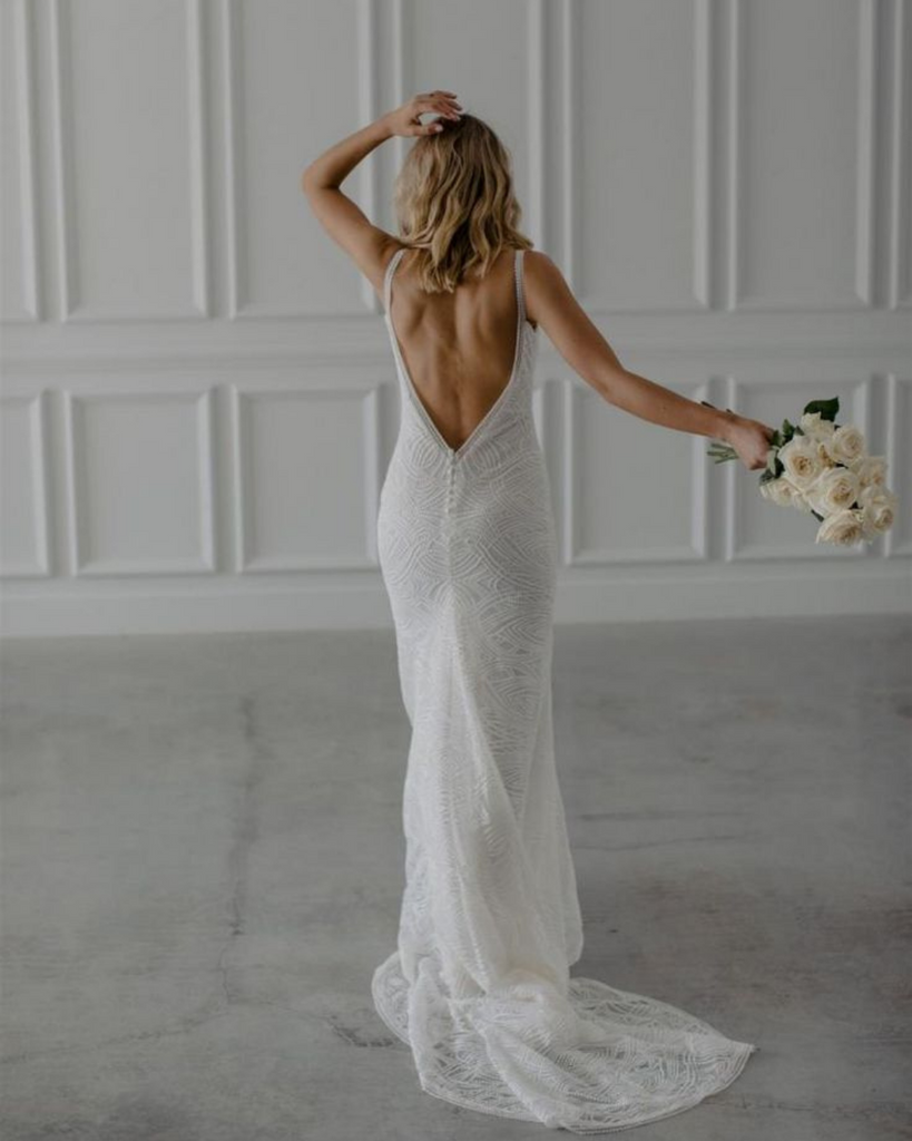 Woman wearing Made With Love Scottie open back bridal gown