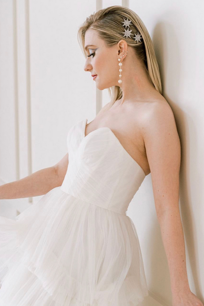 Model wearing bohemian Watters Avance wedding dress