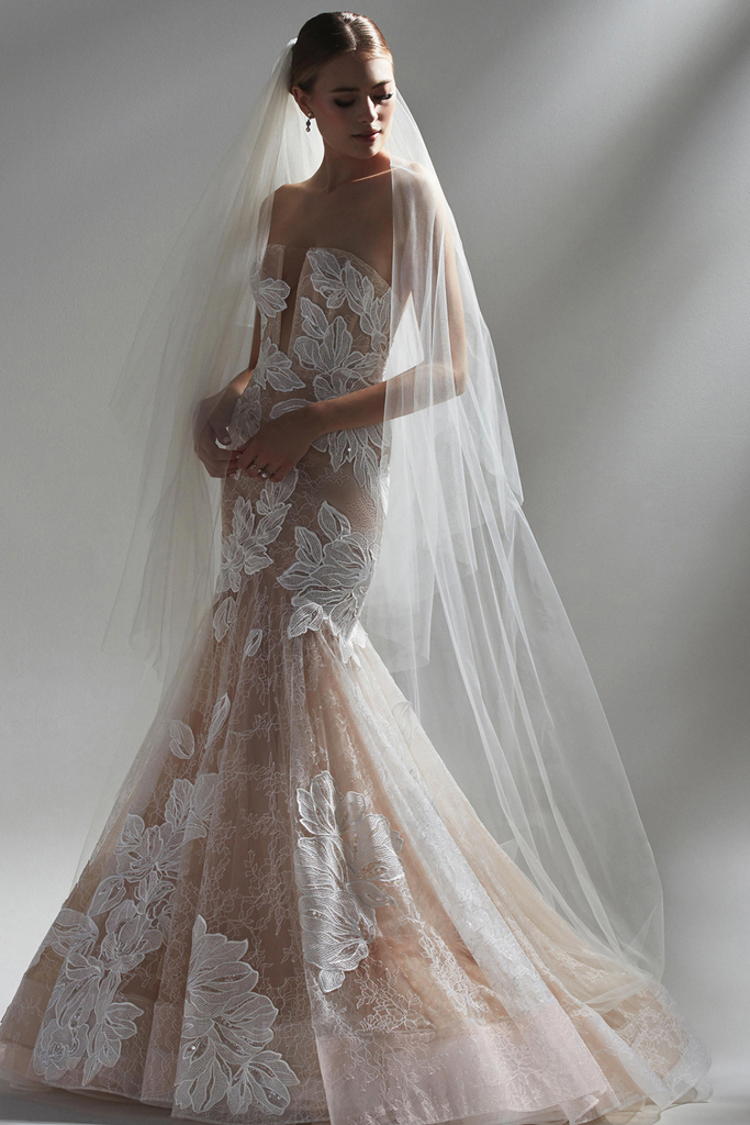 Model wearing Watters Sirena fitted wedding dress. 