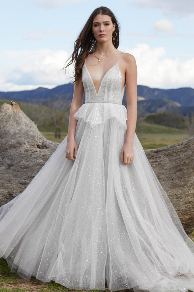 Model wearing Willowby by Watters Larimar wedding dress. 