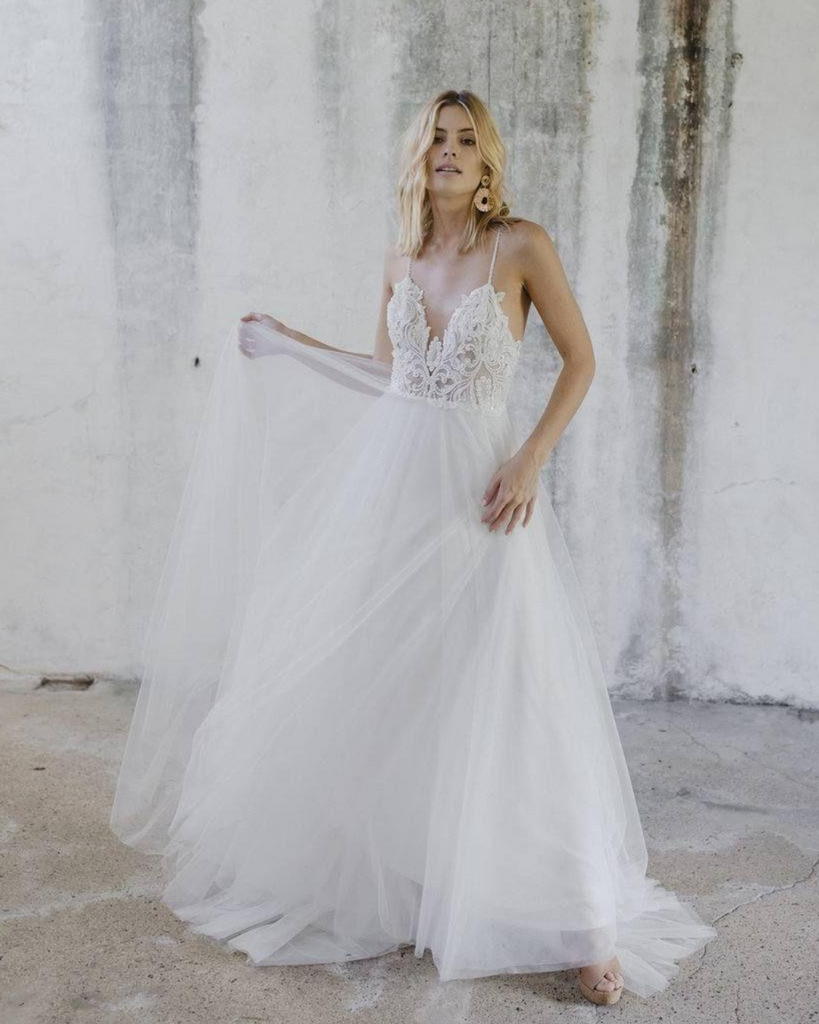 woman wearing Made With Love Willow flowy wedding dress