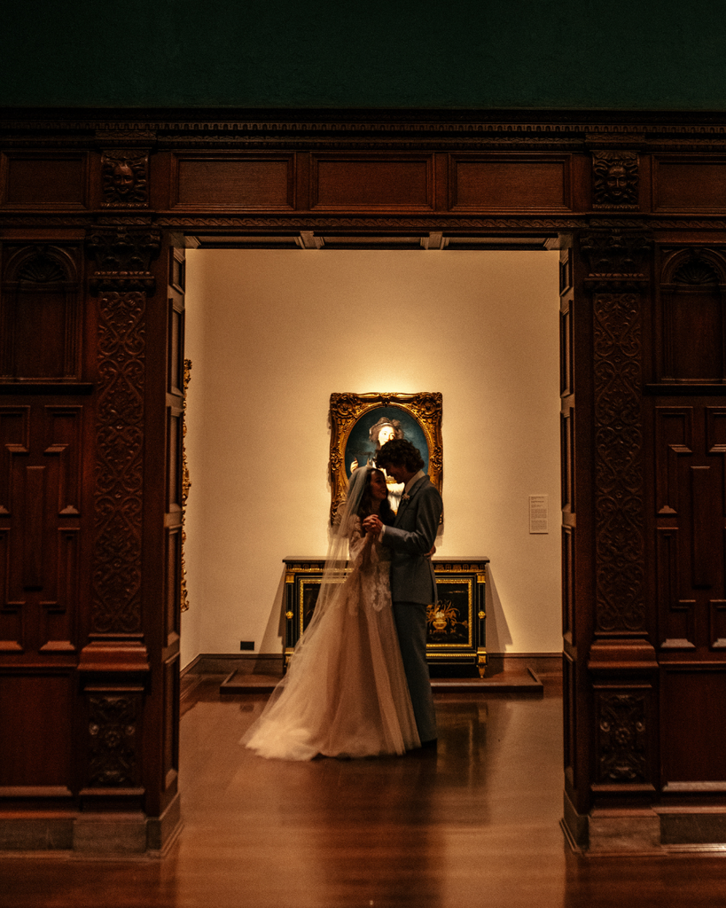 bride and groom standing the the Cincinnati Museum of Art