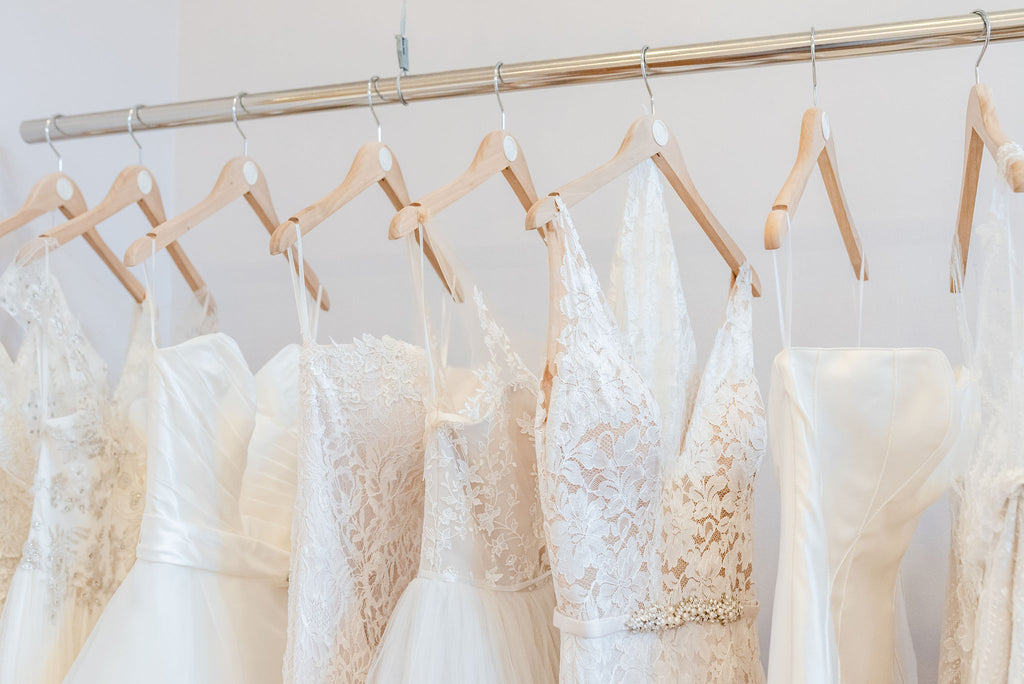 Designer wedding dresses hanging in Luxe Redux Bridal Boutique in Columbus Ohio
