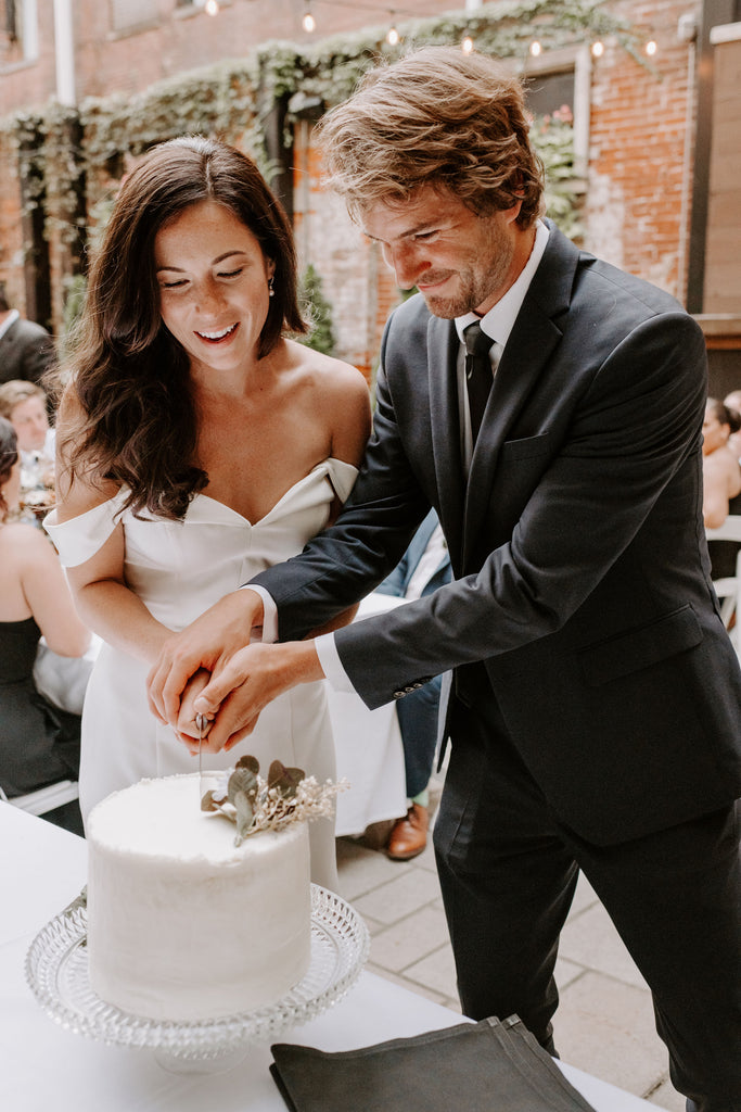 Hotel Covington bride and groom cut wedding cake