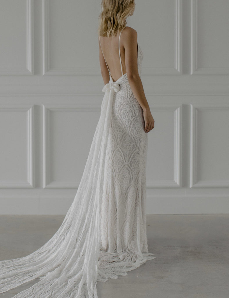 Woman wearing bohemian lace fitted wedding dress