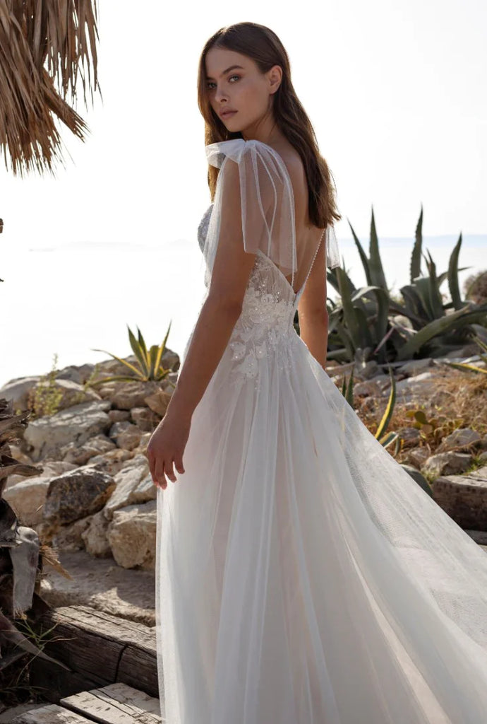 Trending Wedding Dress Styles // Bridal Bows, Lace Sleeves, Exposed Co ...