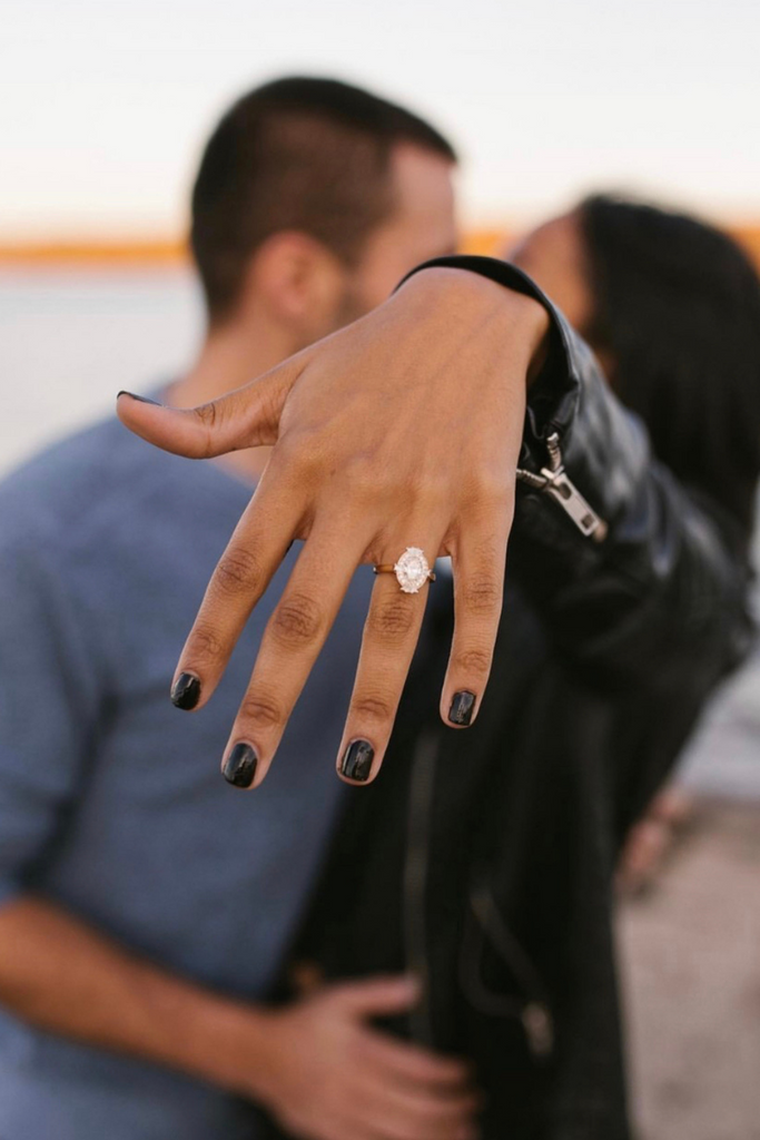 woman showing off engagement ring after proposal