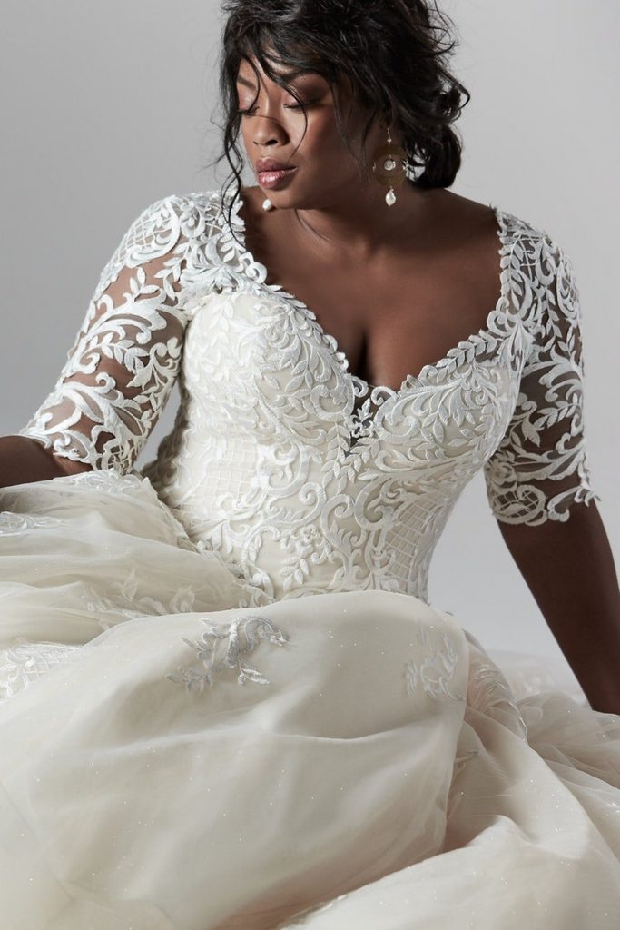 woman modeling Maggie Sottero River Lynette Dawn sophisticated ball gown with embroidered lace
