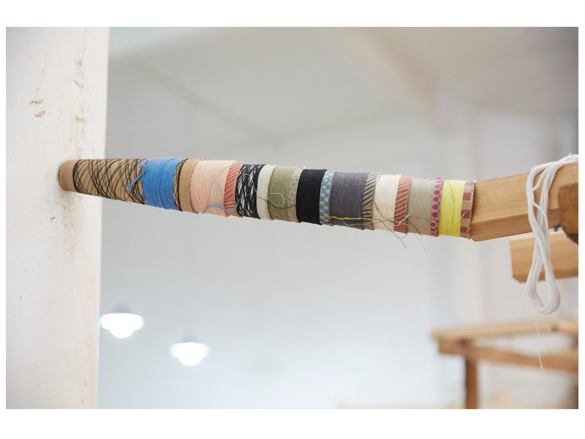 This image shows a stack of different colored yarn spoons in the Marrakshi Life atelier.