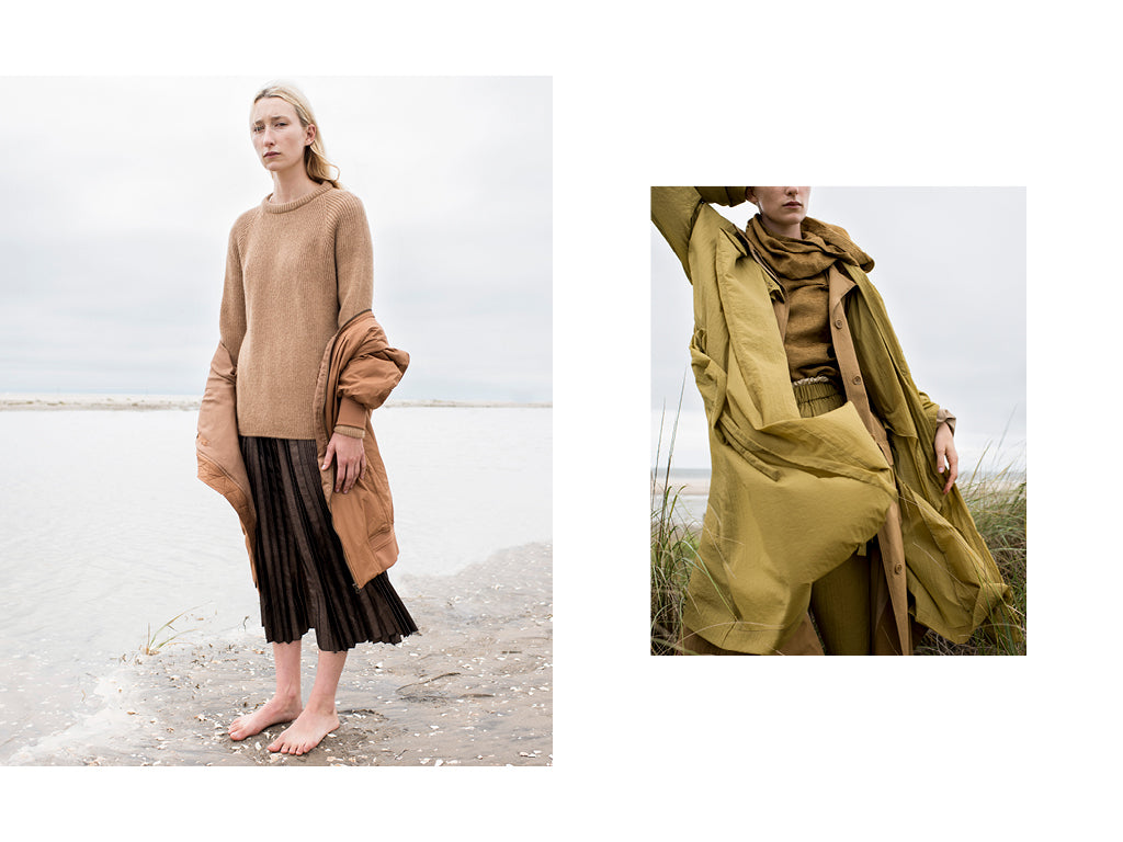 The first image is of a woman with blonde hair standing on the beach wearing a Baserange sweater with a Rito pleated skirt and padded jacket. The second image is a crop of the same woman wearing a Mustard colored pant, top and layered jacket by NEHERA.