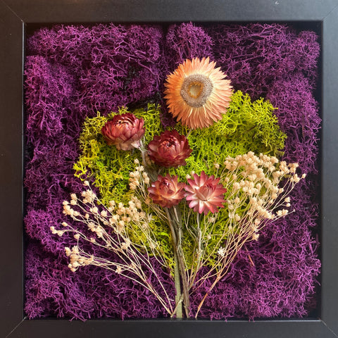 Moss art with purple and green moss, baby's breath and straw flowers