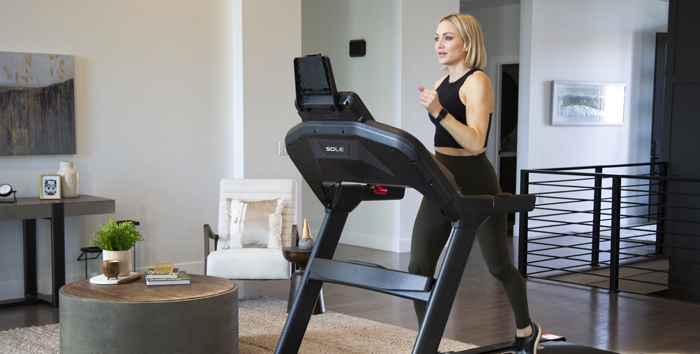 Man running on an incline Treadmill in the bedroom