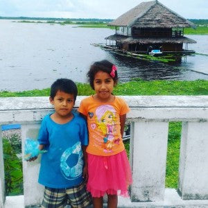 Young residents of Peruvian region devastated by flooding.