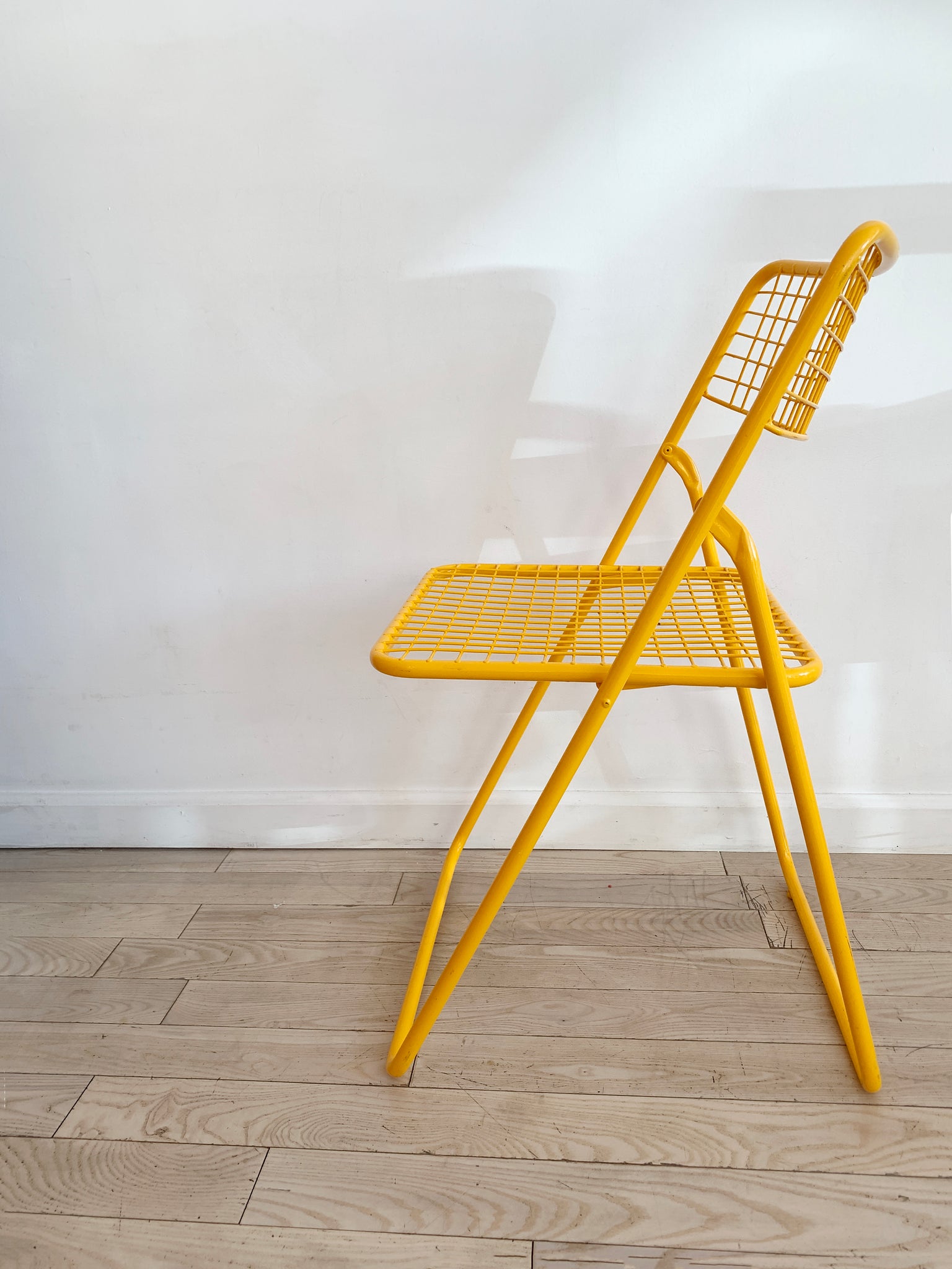yellow metal grid folding chairsniels gammelgaard for