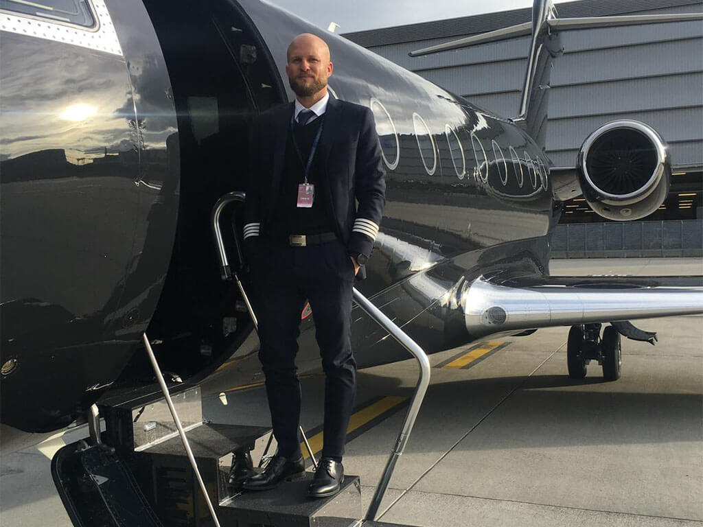 Pilot Petr Uhlíř stands by the bizjet