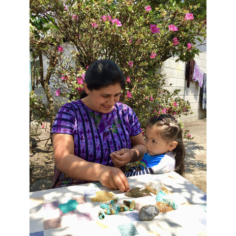 ARTISAN IN GUATEMALA WITH HER DAUGHTER BEADING