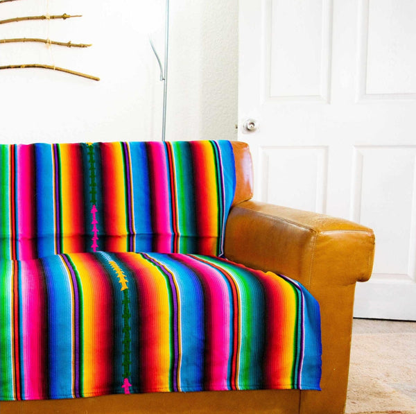 hacienda striped woven guatemalan boho blanket on a couch