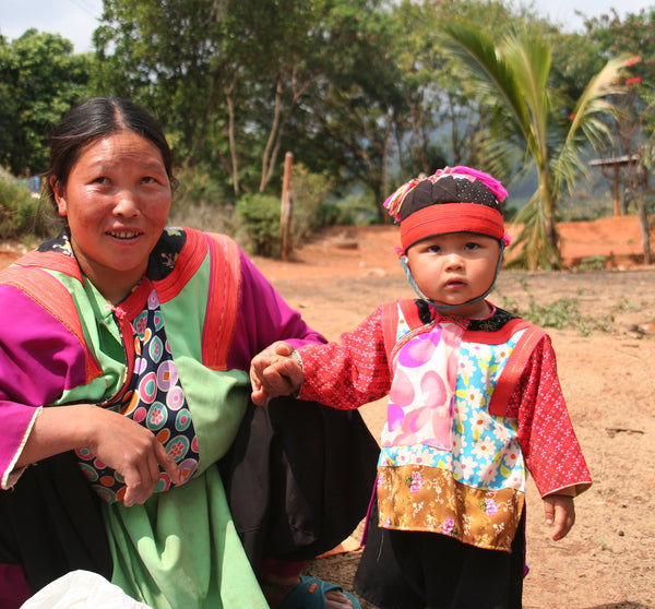 hmong mom and child in traditional clothing