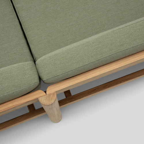 A studio photo of Haven Sofa Sunbrella Leaf / Cushion Arm