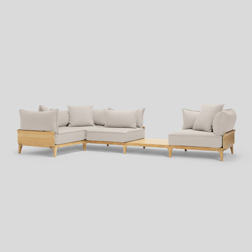 A studio photo of Bluff Sectional with In-line Table Sunbrella Parchment / Four Piece with In-line Table