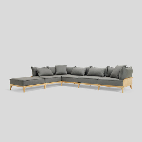 A studio photo of Bluff Chaise Sectional Sunbrella Graphite / Five Piece with Chaise