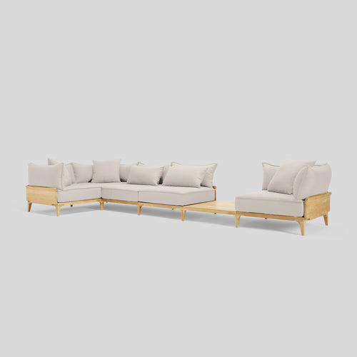 A studio photo of Bluff Sectional with In-line Table Sunbrella Parchment / Five Piece with In-line Table